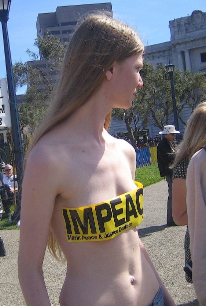 pretty girl goes almost naked to protest the war in iraq